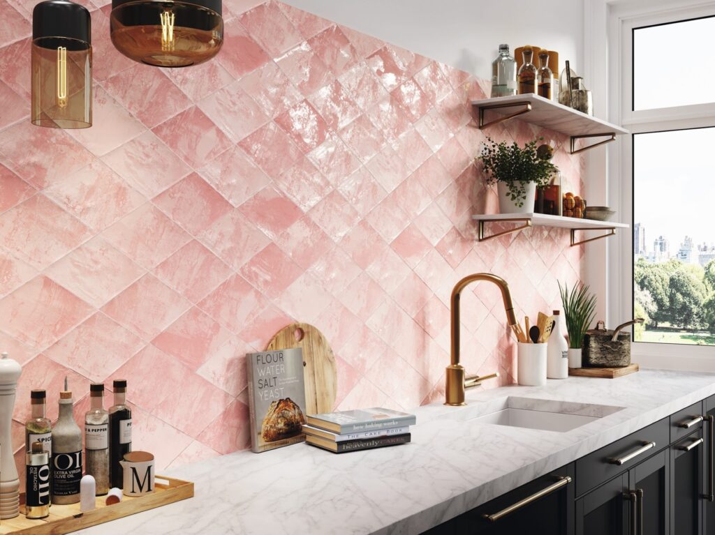 Pink tiles on the wall of a kitcsh-styled kitchen