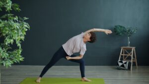Woman practicing yoga in a room