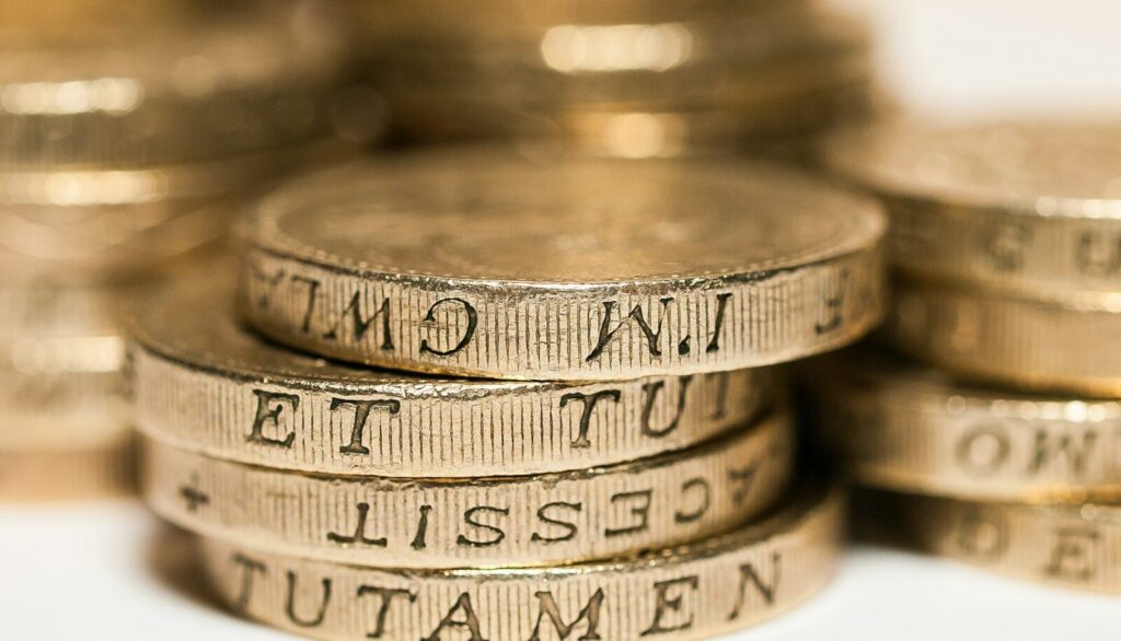 a pile of gold coins sitting on top of each other